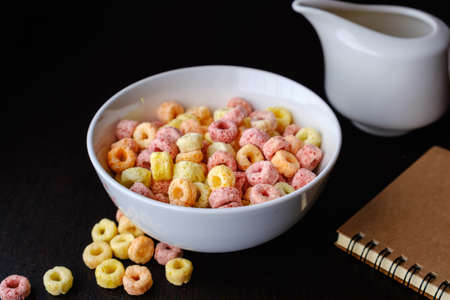 Cereal flakes in bowl with copy space,Breakfast concept.Food with delicious fruity taste and fruity colours.It's made with maize,wheat,and barleyの写真素材