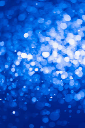 Blue glitter bokeh of light.Abstract blurred lightの写真素材