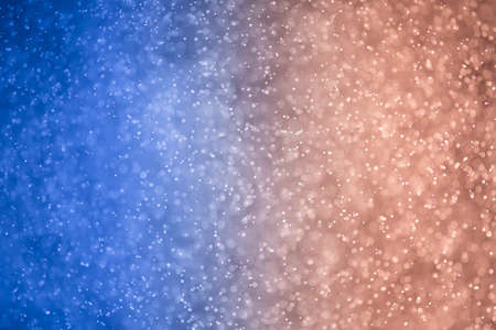 glitter bokeh of light background .Abstract blurred light.blue and red colorの写真素材