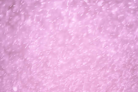 Glitter bokeh of light background.Abstract blurred light.Purple colorの写真素材