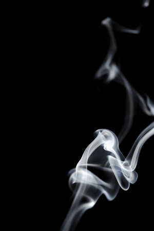 White smoke on black backgroundの写真素材