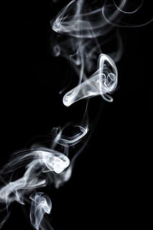 White smoke on black backgroundの写真素材