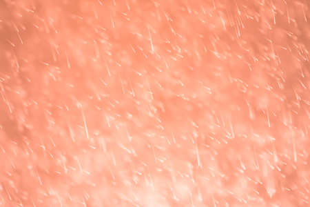 Orange color glitter bokeh of light background.Abstract blurred lightの写真素材