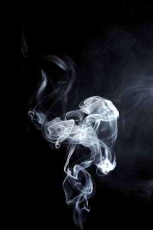 White smoke on black backgroundの写真素材