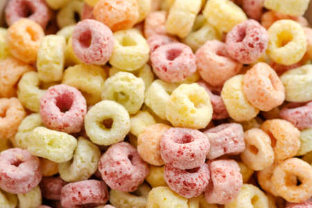 Cereal flakes in bowl with copy space,Breakfast concept.Food with delicious fruity taste and fruity colours.It's made with maize,wheat,and barleyの写真素材