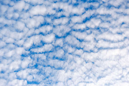 White cloudy with a blue  sky.Wave clouds on the sky.Fluffy cloudの写真素材