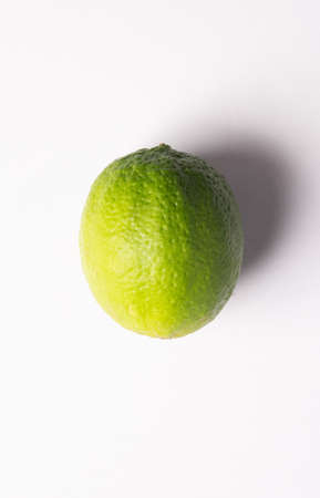 Green lime on white background.fresh lime.Lemon on white scene.の写真素材