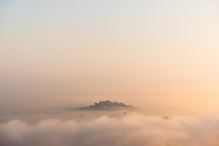 Surreal landscape of morning foggy..Morning clouds at sunrise.Landscape of fog and mountains of northern Thailandの写真素材