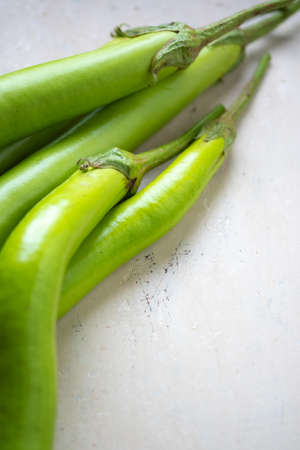 Close up and selective focus green eggplant.Eggplant on white backdrop.Vegetable on tableの写真素材