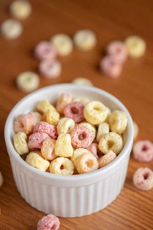 Cereal flakes in bowl ceramic with copy space,Breakfast concept.Food with delicious fruity taste and fruity colours.It's made with maize,wheat,and barleyの写真素材