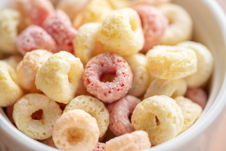 Close-up of cereal flakes food back ground.Food with delicious fruity taste and fruity colours.It's made with maize,wheat,and barleyの写真素材