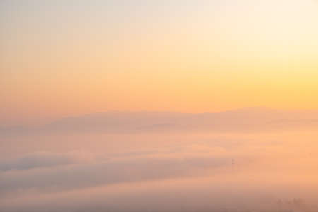 Surreal landscape of morning foggy..Morning clouds at sunrise.Landscape of fog and mountains of northern Thailandの写真素材