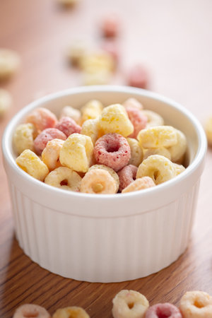 Cereal flakes in bowl ceramic with copy space,Breakfast concept.Food with delicious fruity taste and fruity colours.It's made with maize,wheat,and barleyの写真素材