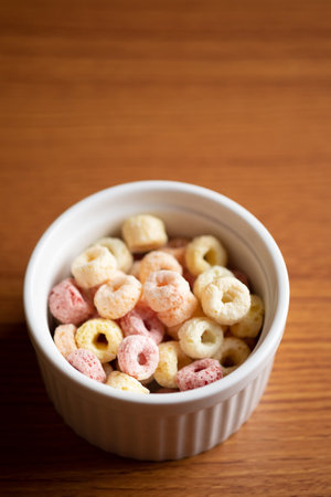 Cereal flakes in bowl ceramic with copy space,Breakfast concept.Food with delicious fruity taste and fruity colours.It's made with maize,wheat,and barleyの写真素材