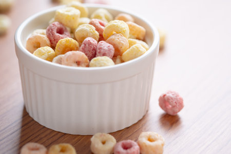 Cereal flakes in bowl ceramic with copy space,Breakfast concept.Food with delicious fruity taste and fruity colours.It's made with maize,wheat,and barleyの写真素材