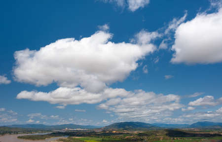 The sky has clouds and the Mekong River.sky and cloud.white clouds.Village near the river.Border river.River border Thailand and Laos. Chiang Saen,Chiang Raiの写真素材