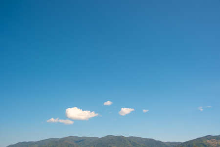 The white clouds have a strange shape and country side.Cloudy and blue skyの写真素材