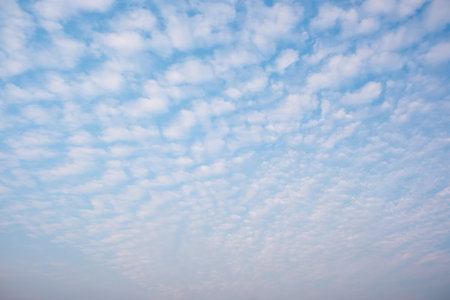 White cloudy with a blue  sky.Wave clouds on the sky.Fluffy cloudの写真素材