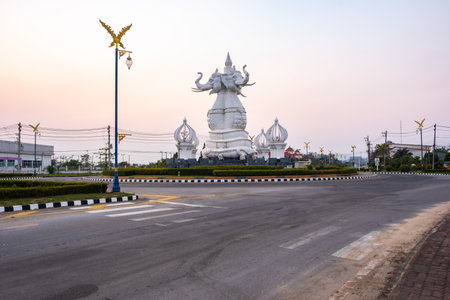 Chiang saen ,Chiang Rai, Thailand.February 2,2021 ;Statue elephant-snake. A white three-headed elephant statue at the intersection before Chiang Saen Hospital. Chiang saen,Chiang Rai,Thailandのeditorial素材