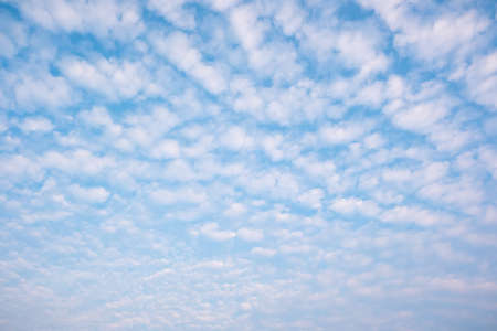 White cloudy with a blue  sky.Wave clouds on the sky.Fluffy cloudの写真素材