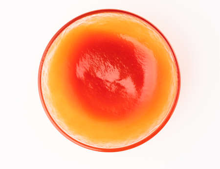 Tomato ketchup in glass bowl on white background.の写真素材
