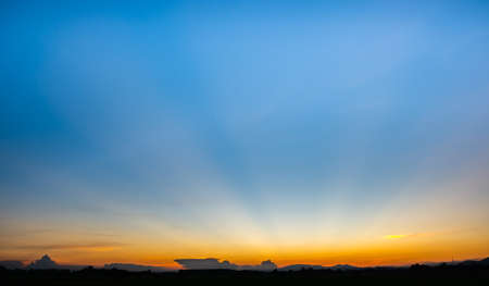 Colorful sunset and sunrise with clouds.Orange color of nature.Many clouds in the sky. sunset in the clouds.The sky is twilightの写真素材