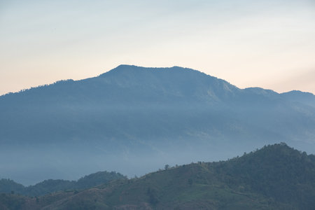 Surreal landscape of morning foggy..Morning clouds at sunrise.Landscape of fog and mountains of northern laos.の写真素材