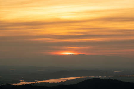 Aerial view of endless lush pastures of CHIANGRAI. landscape on sunset.The sun's reflection on the river.の写真素材