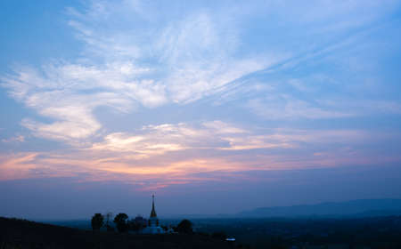 Colorful sunset and sunrise with clouds.Blue and orange color of nature.Many white clouds in the blue sky.The weather is clear today.sunset in the clouds.The sky is twilightの写真素材