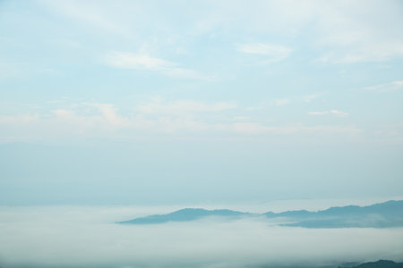 Surreal landscape of morning foggy..Morning clouds at sunrise.Landscape of fog and mountains of northern Thailandの写真素材