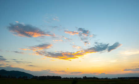 Colorful sunset and sunrise with clouds. Blue and orange color of nature. Many white clouds in the...