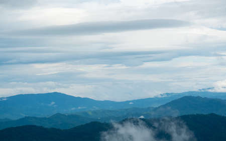 Surreal landscape of morning foggy..Morning clouds at sunrise.Landscape of fog and mountains of northern Thailandの写真素材