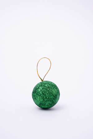 Christmas decorative Christmas ball.Green ball on white backgroundの写真素材
