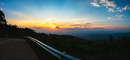 Colorful sunset and sunrise with clouds. Blue and orange color of nature.The sun is going down the horizonの写真素材