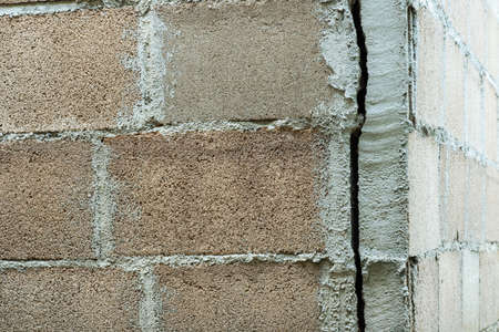 The house wall broke off from the pillars.cracked cornerの写真素材