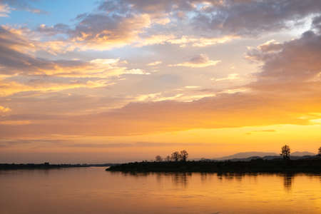 Colorful sunset and sunrise with clouds. Blue and orange color of nature. Many white clouds in the...