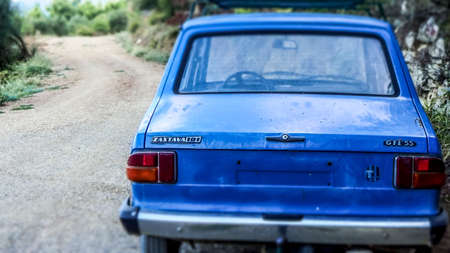 Blue and lonley Zastava Car GTL 55 on an empty Path within the Biokovo Mountains in Makarska, Croatiaのeditorial素材