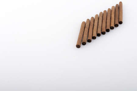 Brown cigar tobacco on a white backgroundの写真素材