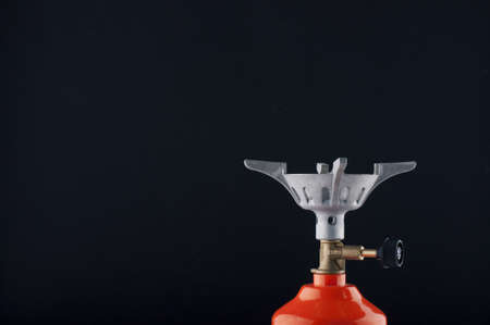 Camp burner valve with a black on black background