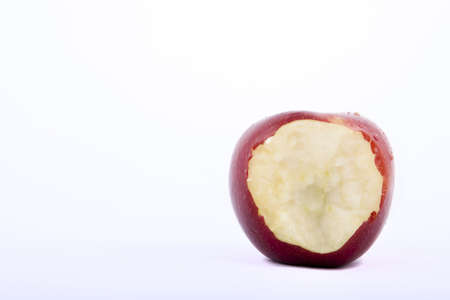 bitten apple on a white backgroundの写真素材