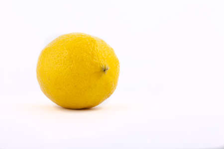 yellow lemon on a white backgroundの写真素材