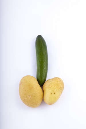potatoes and cucumber on a white backgroundの写真素材
