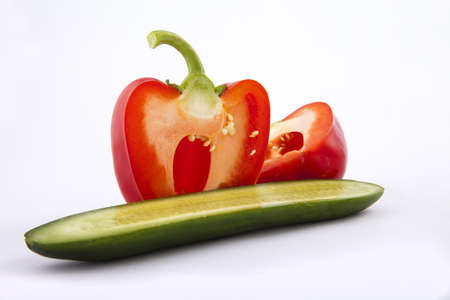  peppers and cucumber on a white backgroundの写真素材