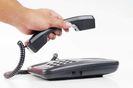A hand pick up a phone with isolated white background
