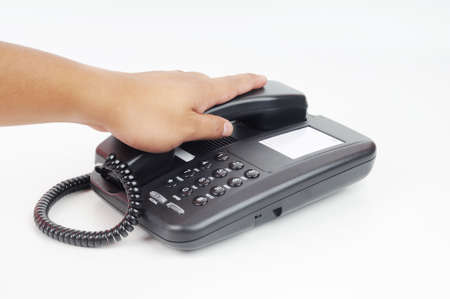 A hand ready or holding a telephone isolated with white backgroundの写真素材