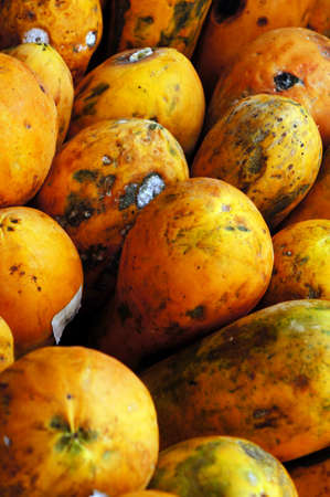 Rotten papaya is saparate with others. の写真素材