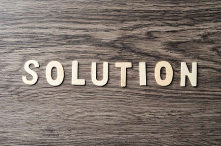 Wooden Word Solution On Wood Texture Backgroundの写真素材