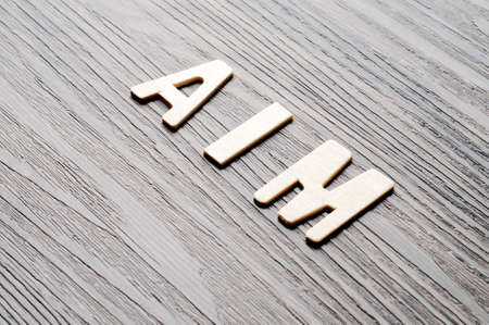 Wooden Word Aim On Wood Texture Backgroundの写真素材