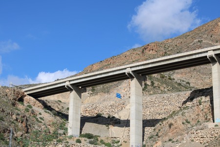 View from below of suspended highway at rocky mountain footの写真素材