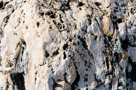 Mountain stone corroded by winds and waves on the coast of Spainの写真素材